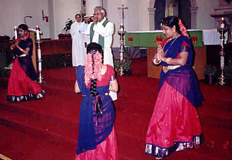 Fr. D'Sa performs arati towards the congregation
